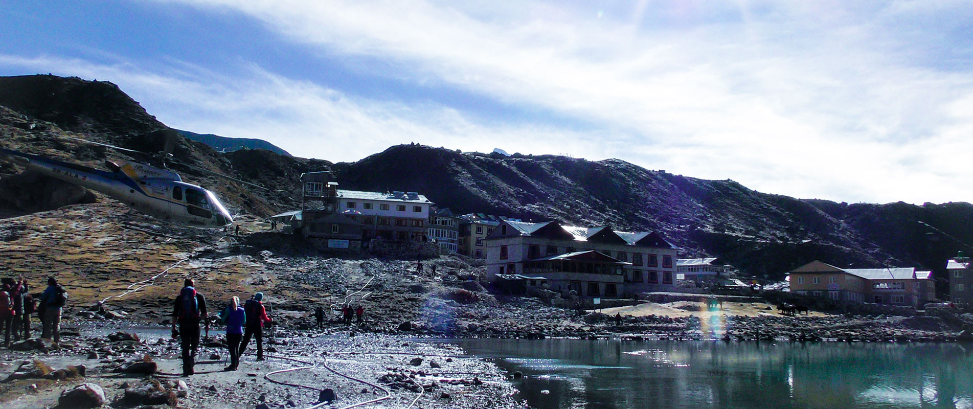 Helicopter above trekkers at Gokyo village near Gokyo lake for Everest Mountain Helicopter Flight