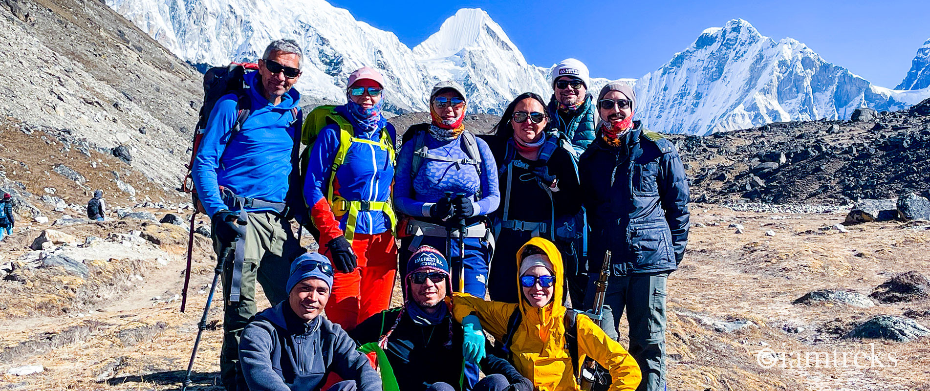 I AM Trekking & Expeditions 2022 Autumn group members at Lobuche with Pumori, Lingtren and Khumbutse in the background.