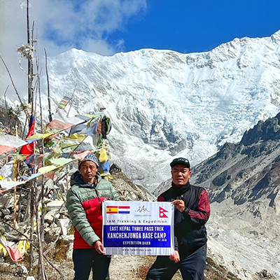 2-men holding banner at Kanchenjunga Base Camp