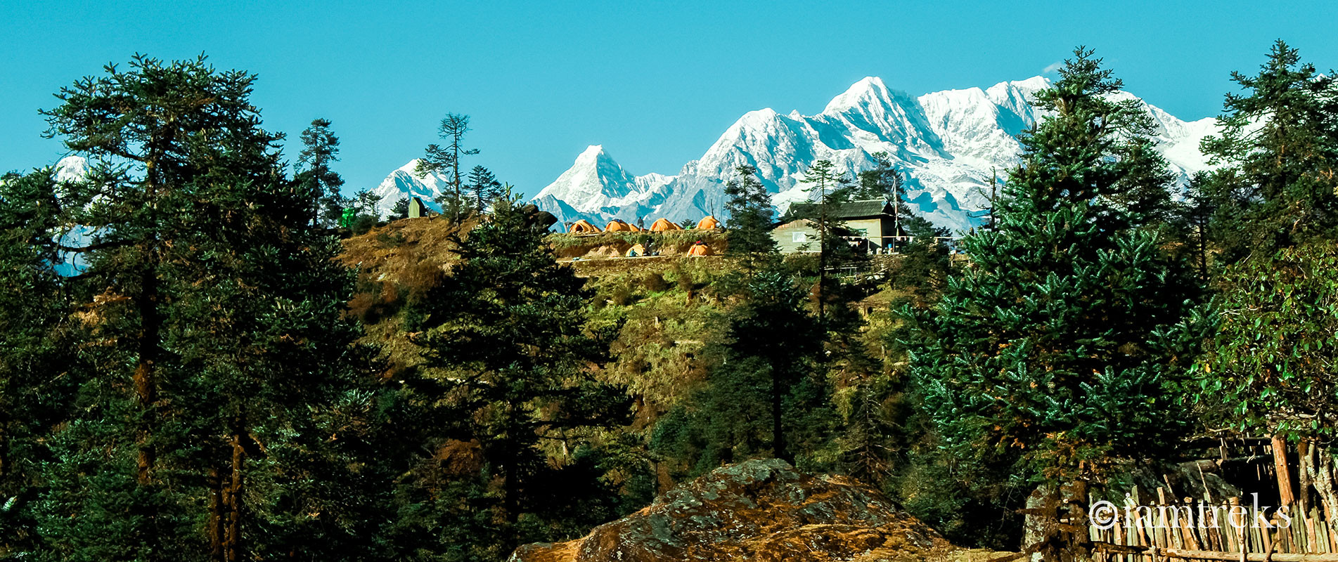 Tents and a house infront of Numbur and Rolwaling Mountain in Goli village on the Pikey peak trek